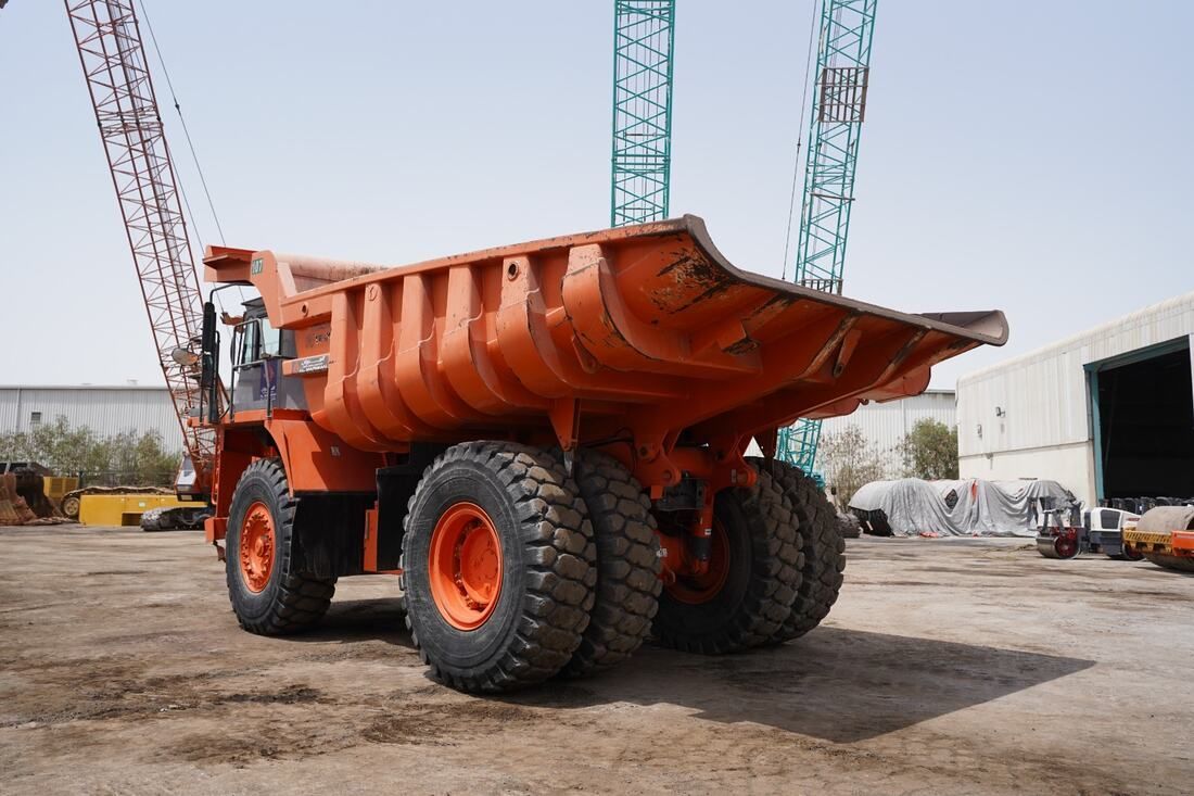 Rigid Dump Truck 2011 Hitachi EH1100-3 - rear left view - Al Marwan Heavy Machinery