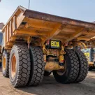 2022 Caterpillar 777E Rigid Dump Truck Rear Left View