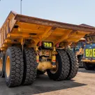 2022 Caterpillar 777E Rigid Dump Truck Rear Left VIew 