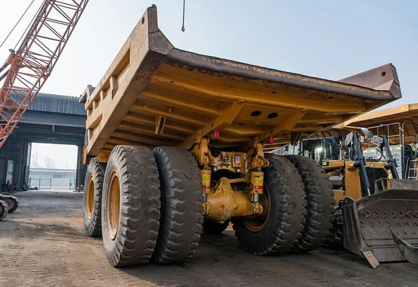 2023 Caterpillar 777 Rigid Dump Truck Rear Left View