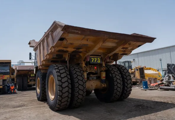 2019 Caterpillar 777E Rigid Dump Truck Rear Left View