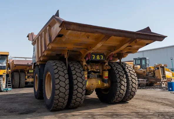 2021 Caterpillar 777E Rigid Dump Truck Rear Left View