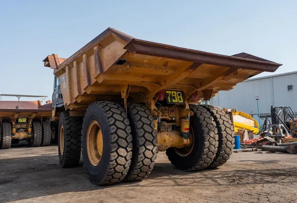2022 Caterpillar 777E Rigid Dump Truck Rear Left View