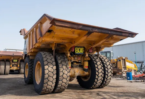 2022 Caterpillar 777E Rigid Dump Truck Rear Left View