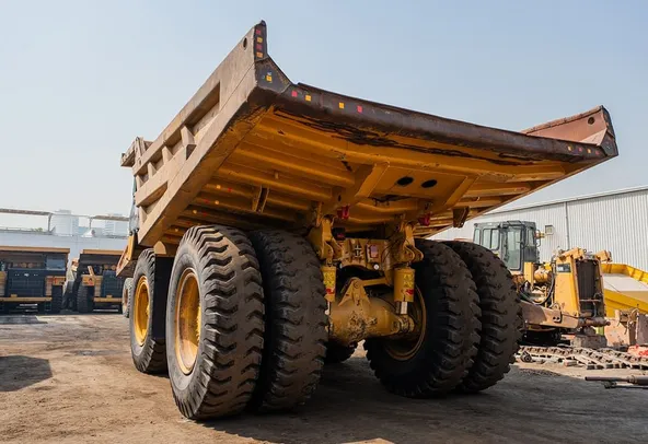 2022 Caterpillar 777E Rigid Dump Truck Rear Left View