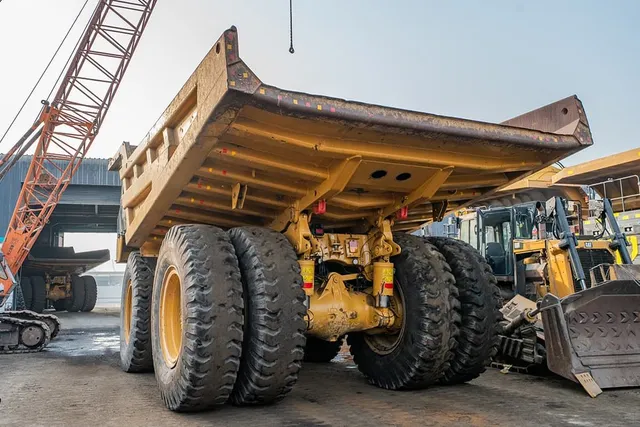 2023 Caterpillar 777 Rigid Dump Truck Rear Left View