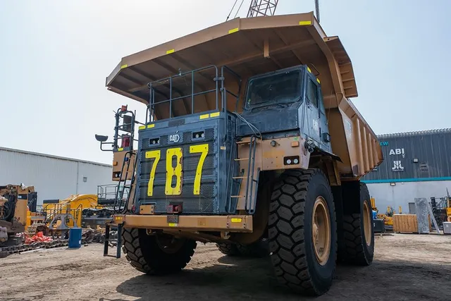 2021 Caterpillar 777E Rigid Dump Truck Front Left View