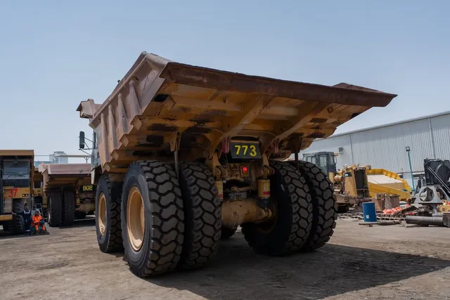 2019 Caterpillar 777E Rigid Dump Truck Rear Left View