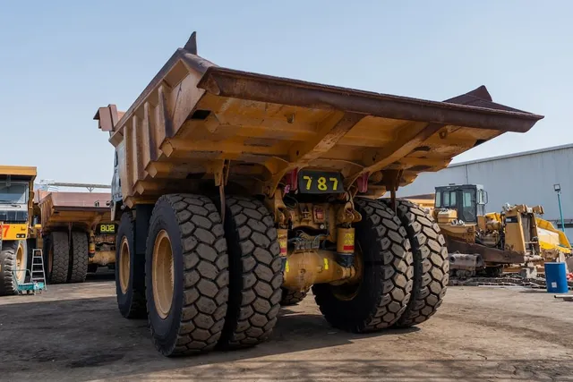 2021 Caterpillar 777E Rigid Dump Truck Rear Left View