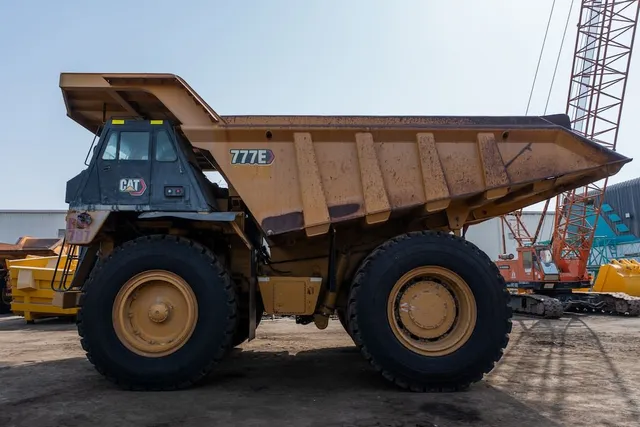 2021 Caterpillar 777E Rigid Dump Truck Left View