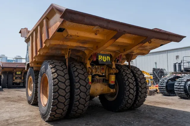 2022 Caterpillar 777E Rigid Dump Truck Rear Left View