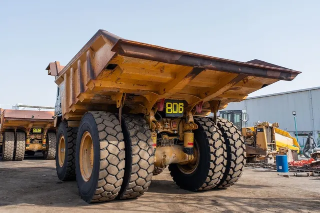 2022 Caterpillar 777E Rigid Dump Truck Rear Left View