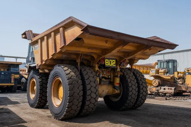 2022 Caterpillar 777E Rigid Dump Truck Rear Left View