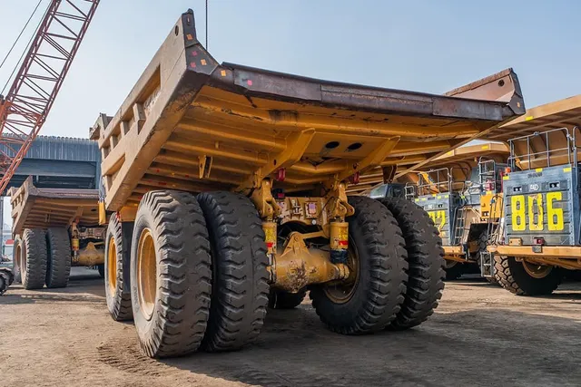 2022 Caterpillar 777E Rigid Dump Truck Rear Left View