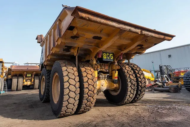 2022 Caterpillar 777E Rigid Dump Truck Rear Left View