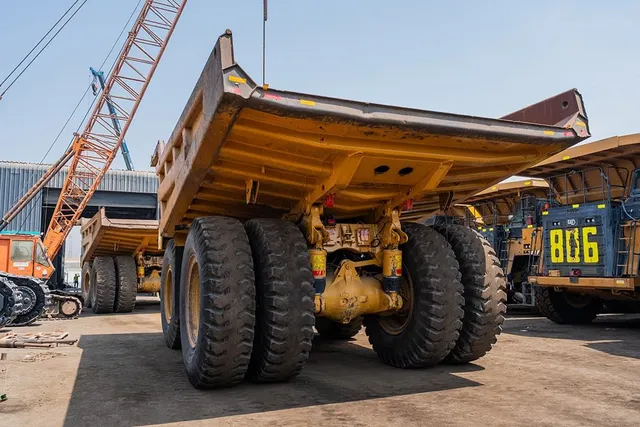 2022 Caterpillar 777E Rigid Dump Truck Rear Left View
