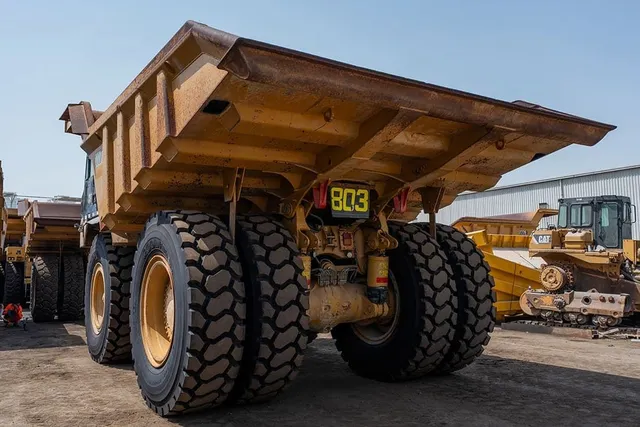 2022 Caterpillar 777E Rigid Dump Truck Rear Left View