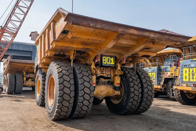 2022 Caterpillar 777E Rigid Dump Truck Rear Left View