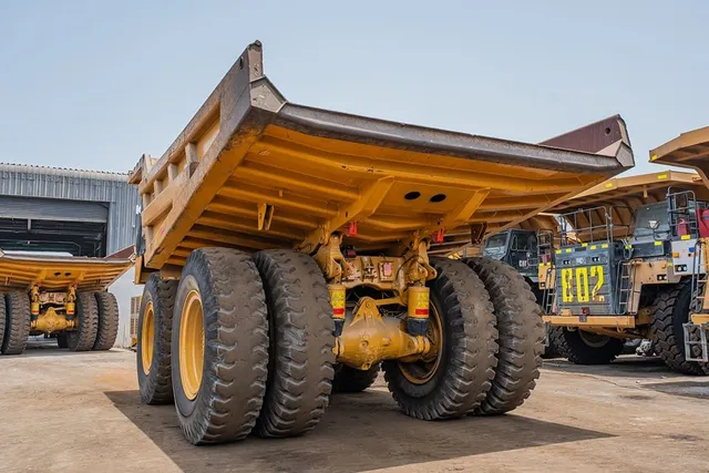 2023 Caterpillar 777 Rigid Dump Truck Rear Left View