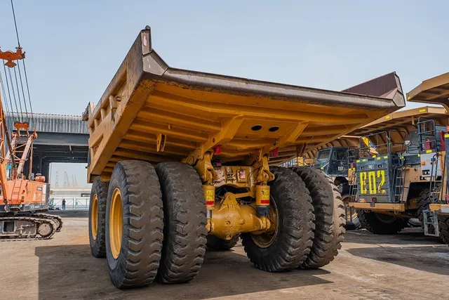 2023 Caterpillar 777 Rigid Dump Truck Rear Left View