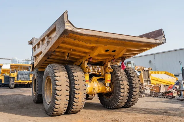 2023 Caterpillar 777 Rigid Dump Truck Rear Left View