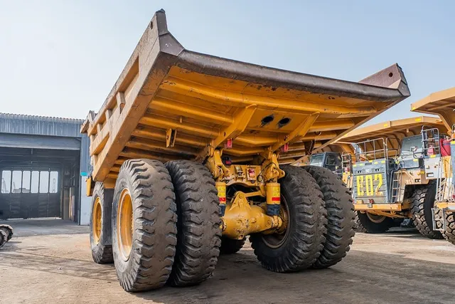 2023 Caterpillar 777 Rigid Dump Truck Rear Left View