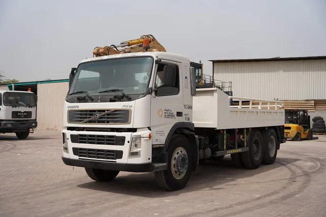 Volvo FM12 Cargo Truck 6x4 - Superior Traction-Spacious Bed-Front-Left-Image
