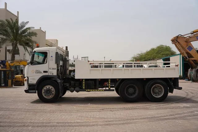 Volvo FM12 Cargo Truck 6x4 - Superior Traction-Spacious Bed-Left-Side-Image