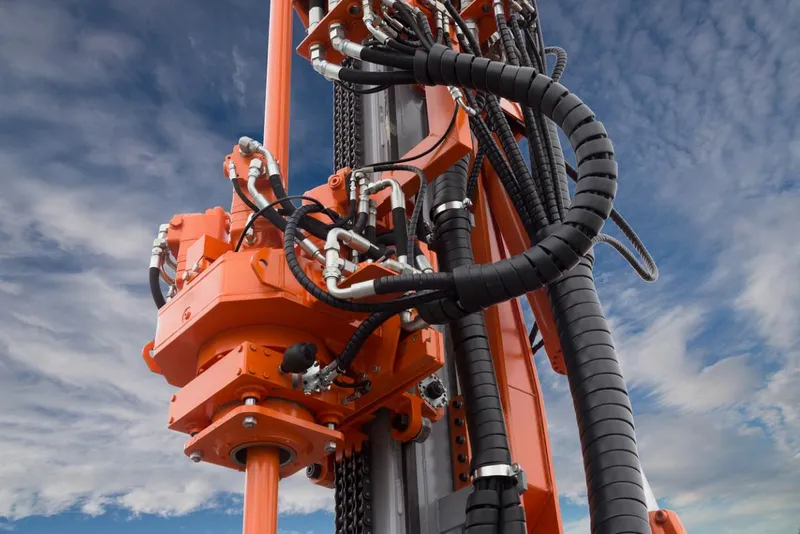 Hydraulic hoses driving the power of a heavy-duty drilling rig