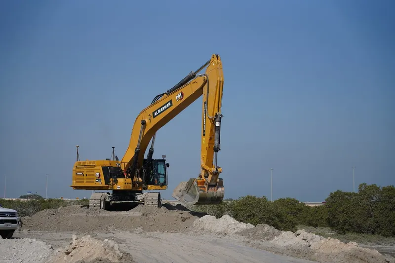A 395 CAT excavator with the long stick configuration as part of Al Marwan Machinery's rental fleet