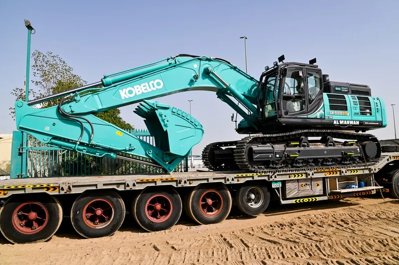 A large KOBELCO SK500 track excavator being loaded off to Saudi Arabia