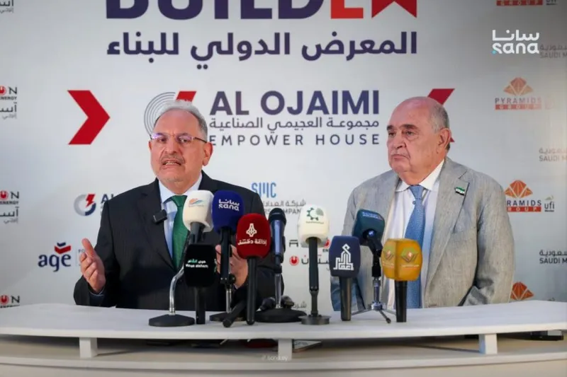 Syrian Finance Minister Mohammed Yisr Barnieh (left) visits the BUILDEX 24 international construction fair in Damascus, June 14.