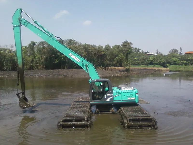 An amphibious SK210 excavator on a shallow waters job site - Image courtesy of Listar