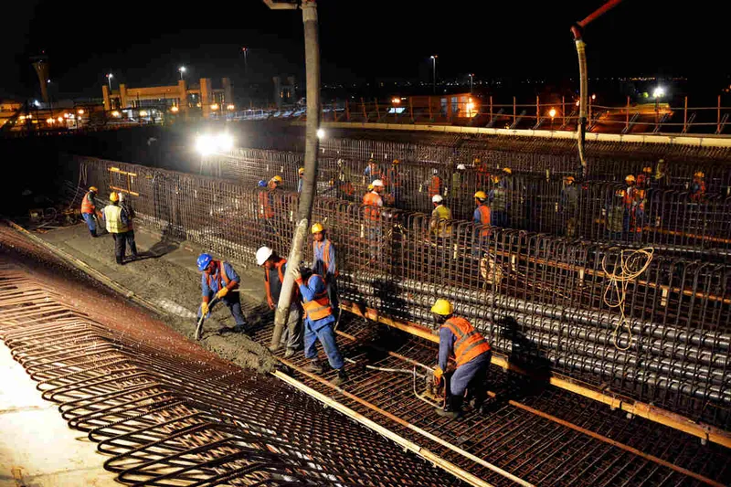 Al Marwan Construct team on a job site in the cooler temperatures during the evening hours