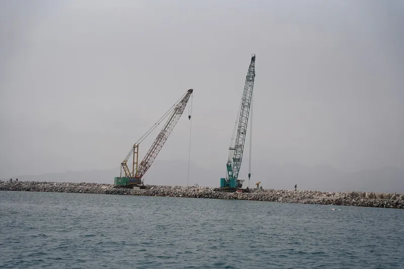 An Al Marwan Machinery Kobelco CKS1350 crawler crane on a Oman job site
