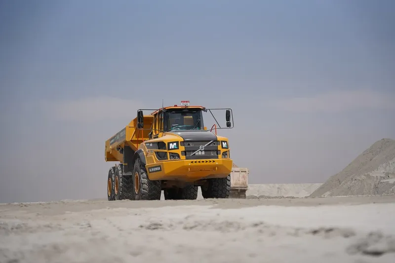 A fleet of Volvo A40G haulers move silt from the sea for on-site aggregate processing in Abu Dhabi, UAE