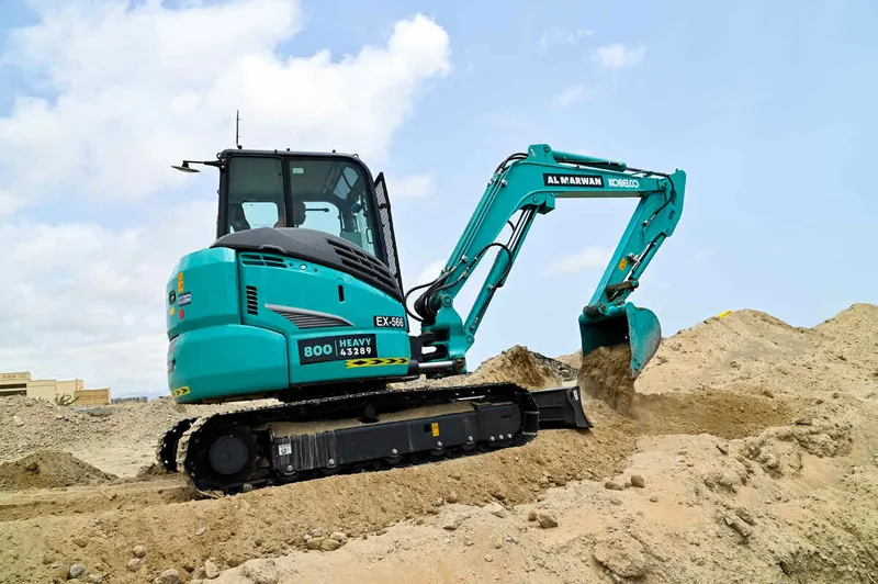 An SK55 Kobelco mini excavator on a UAE job site as part of Al Marwan Machinery fleet