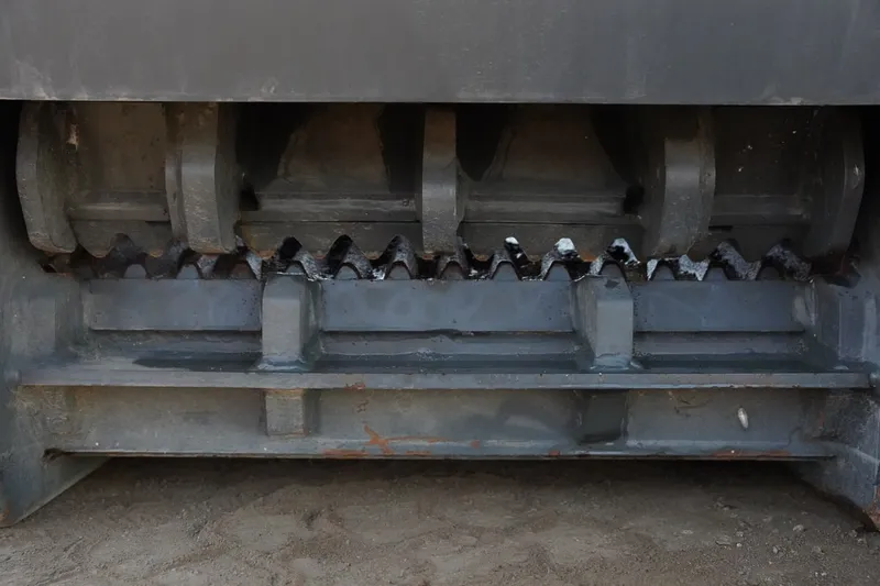 Crushing shafts of a World Attachments screening bucket