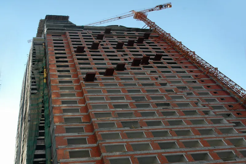 The tower cranes and stilts used in the construction of the DoubleTree by Hilton Hotel Sharjah