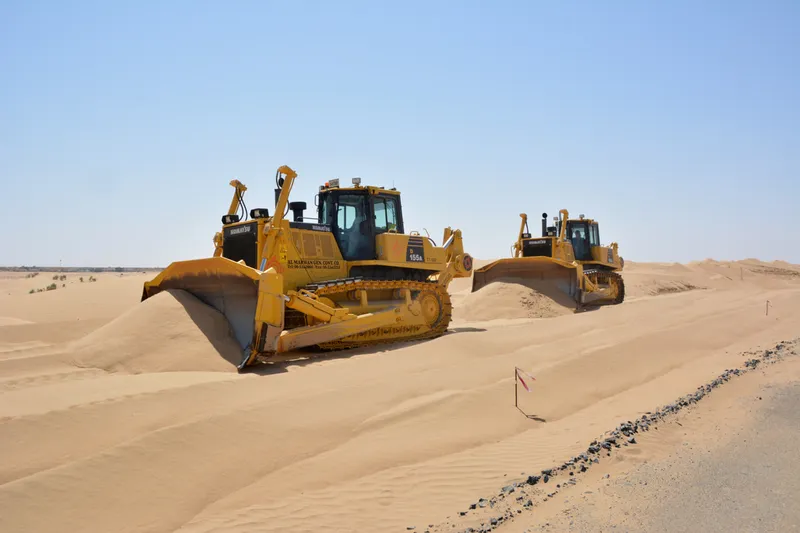 Komatsu D155A dozers grading the plot for the residential and commercial structures at Tilal City