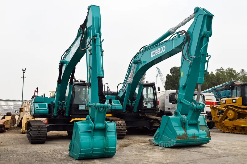Two of Al Marwan Heavy Machinery's trusty KOBELCO excavators on show at the Jebel Ali Free Zone (JAFZA) yard in Dubai, UAE