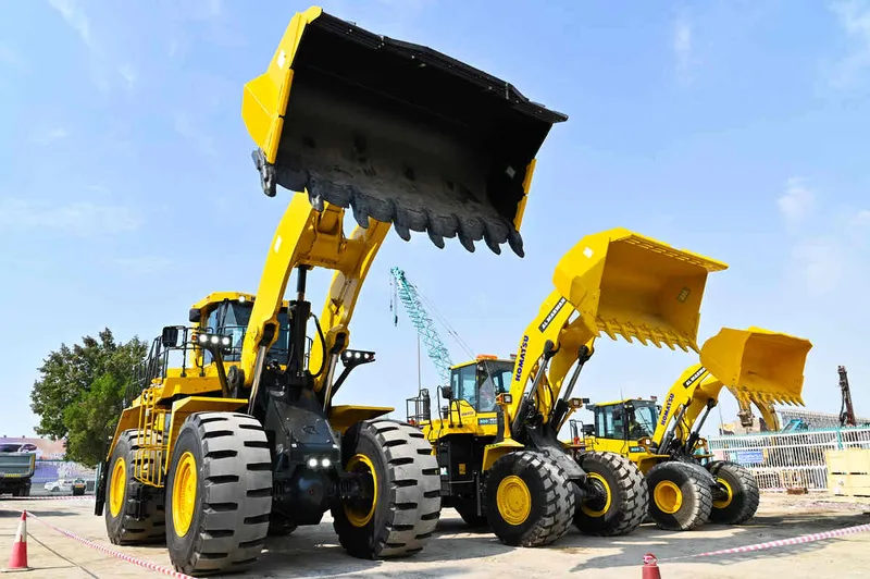 Different weight class Komatsu loaders at Al Marwan’s yard, including the WA900, WA600, WA470