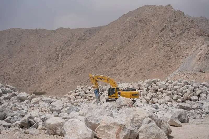 The Komatsu PC500 as part of Al Marwan Machinery's equipment rental fleet working on a quarry site in Oman