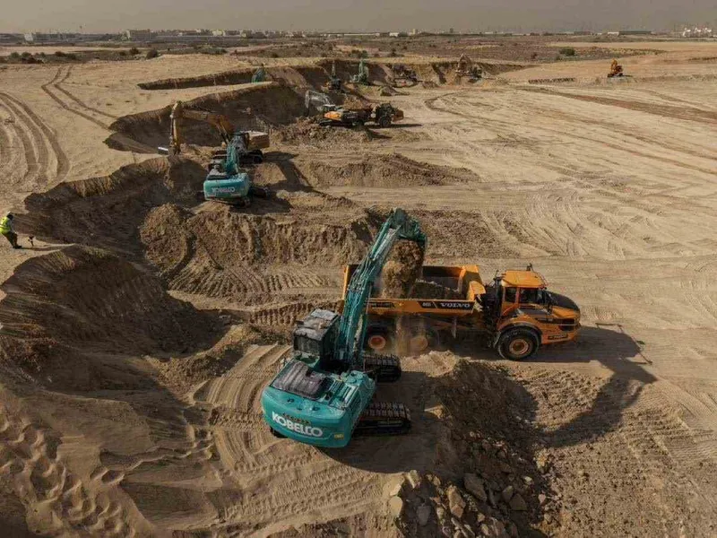 Multiple excavators working together in a UAE project