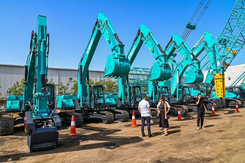 New equipment featuring KOBELCO excavators at Al Marwan Machinery's showroom in JAFZA, Dubai, UAE