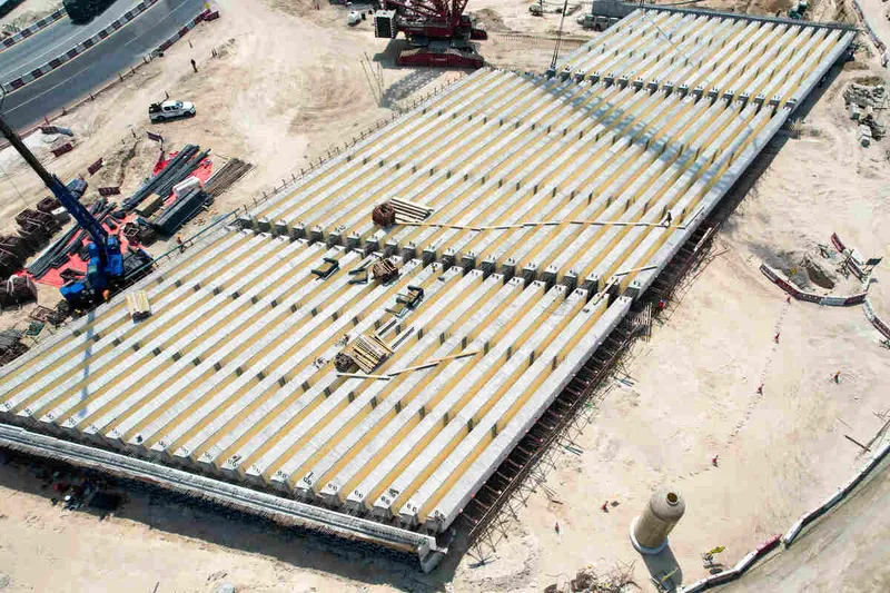 Prefabricated bridge elements being set into place by Al Marwan’s rental equipment fleet at Al Layyah job site