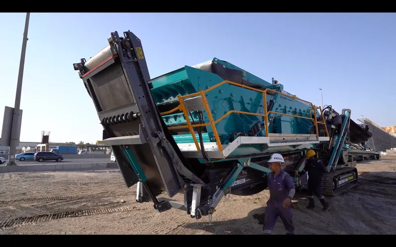 A Picture of an Al Marwan Technician doing a demo of the Chiftain 2100X mobile screener in the Yard of Al Marwan HQ in Sharjah, UAE