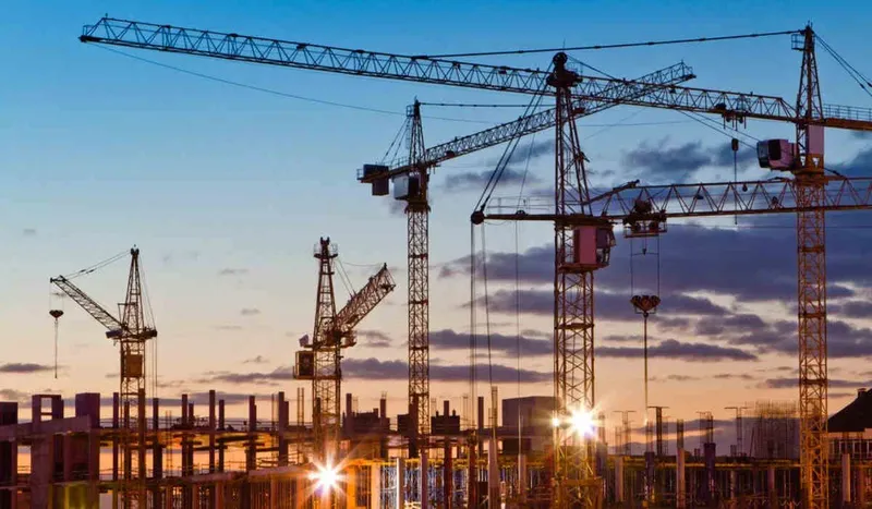 Multiple tower cranes on a construction site