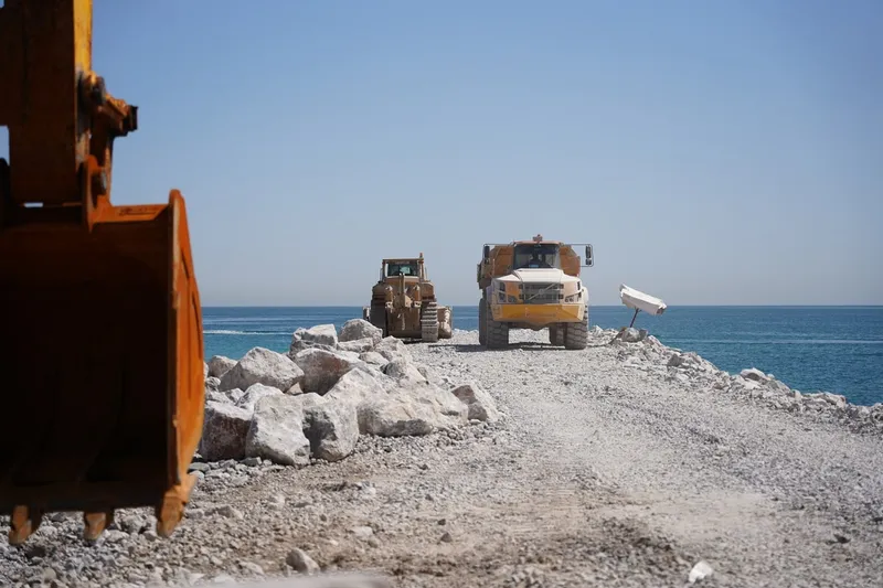 Al Marwan's machinery at work on a marine barriers development project in Oman