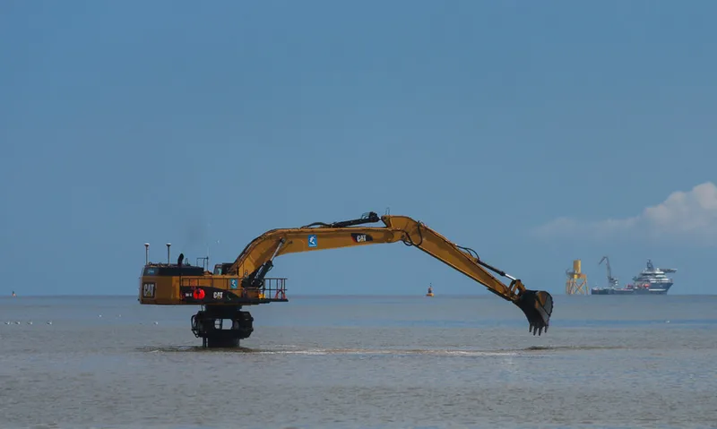 Cat elevated excavator in action